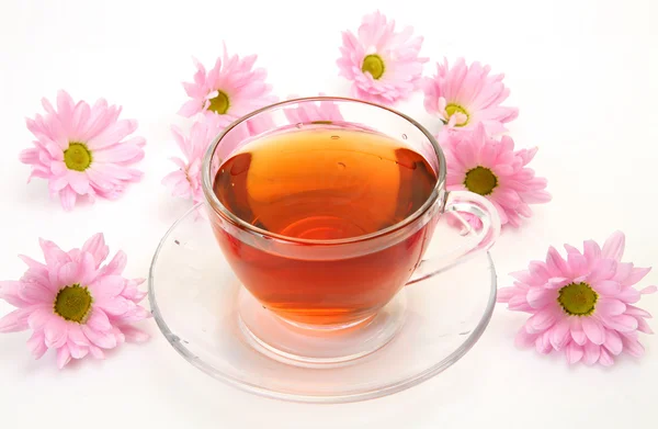 Tea and pink flowers — Stock Photo, Image