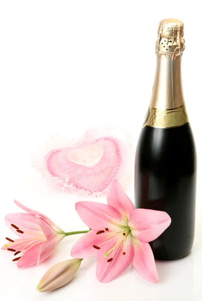 Champagne and pink lilies — Stock Photo, Image