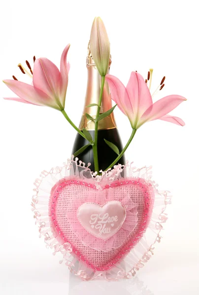 Champagne and pink lilies — Stock Photo, Image