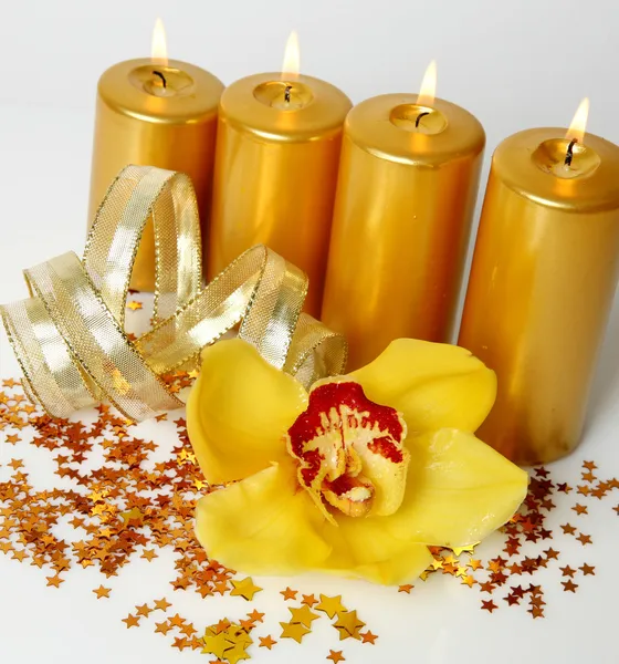 Burning candles and orchid — Stock Photo, Image