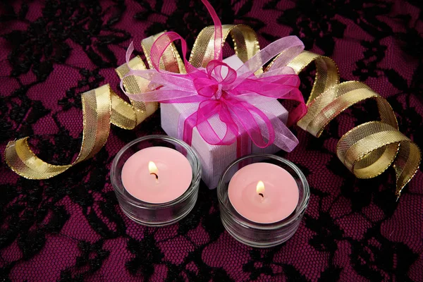 Box with a gift and candles — Stock Photo, Image