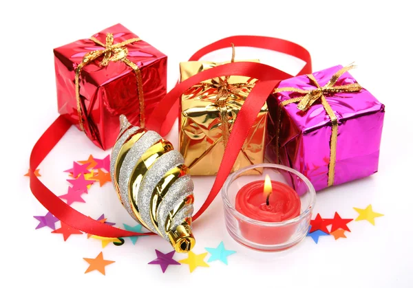 New Year's ornaments and candle — Stock Photo, Image