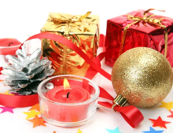 New Year's ornaments and candle — Stock Photo, Image