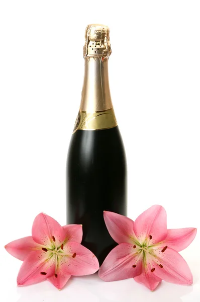 Шампанське та рожеві лілії — стокове фото