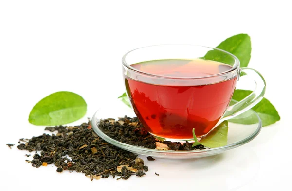 Cup with tea and a leaf — Stock Photo, Image