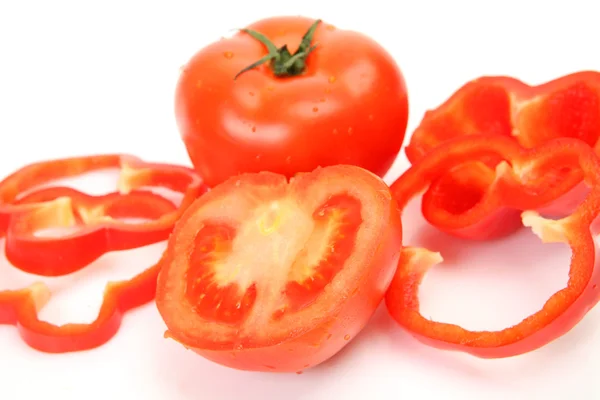 Tomatoes and sliced pepper — Stock Photo, Image