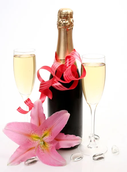 Шампанское и розовая лилия Лицензионные Стоковые Изображения