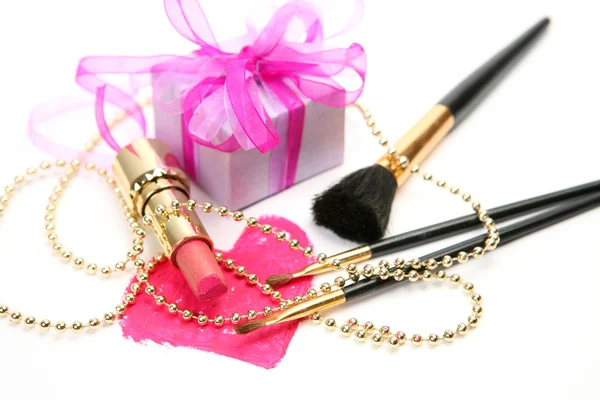 Decorative cosmetics and gift — Stock Photo, Image