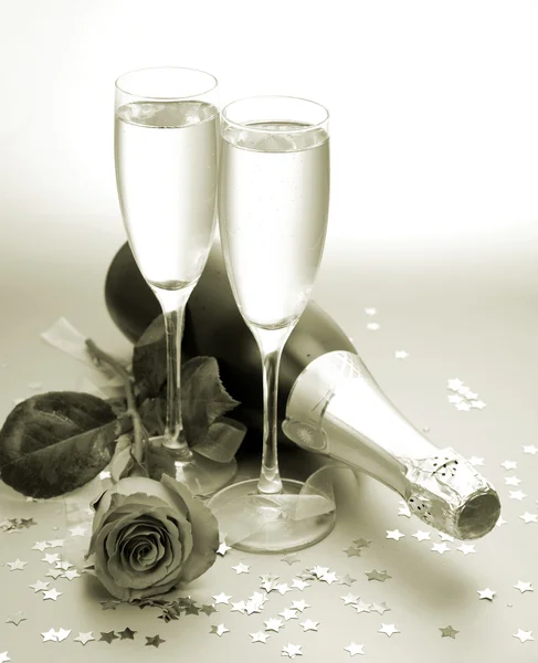 Шампанское и роза Лицензионные Стоковые Изображения