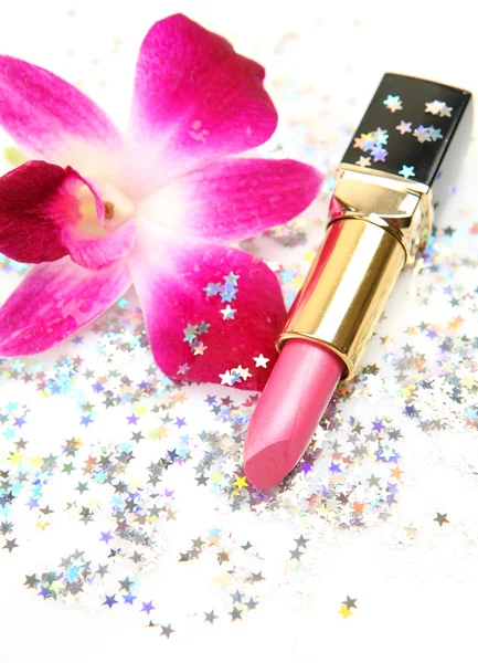 Pink orchid and lipstick — Stock Photo, Image