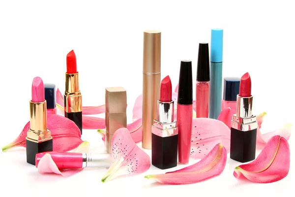 Petals of pink lilies and lipstick — Stock Photo, Image