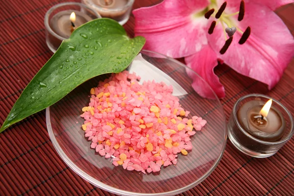 Pink lily and salt — Stock Photo, Image