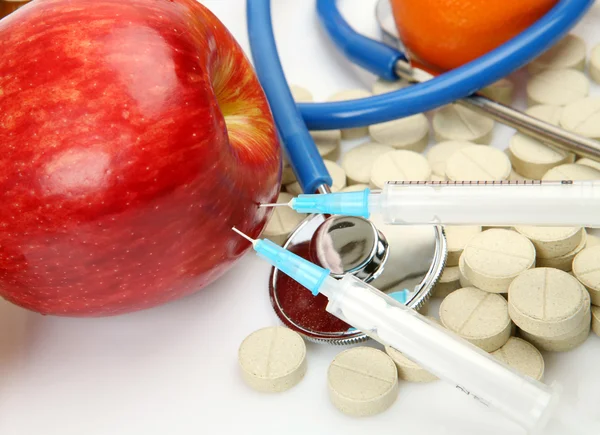 Tablets and fruit — Stock Photo, Image