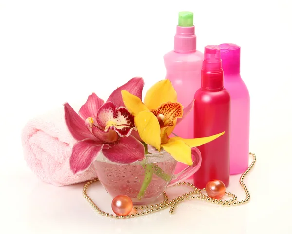 Orchideen und Lotion — Stockfoto