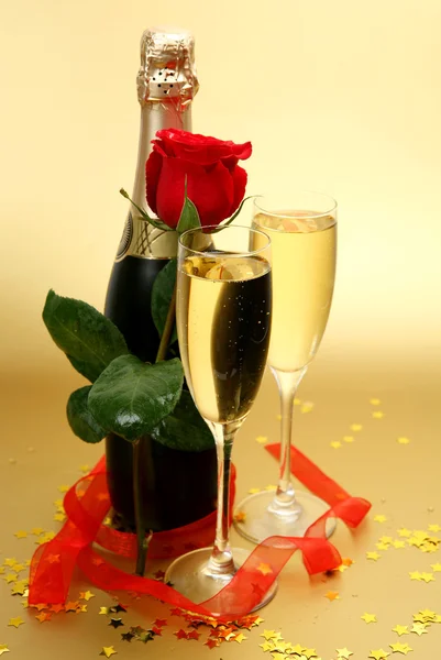 Champagne and ribbon — Stock Photo, Image