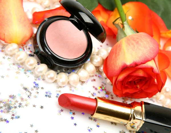 Decorative cosmetics and rose — Stock Photo, Image