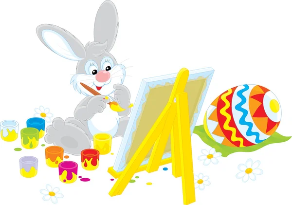 Conejo de Pascua dibujando un colorido huevo de Pascua — Vector de stock