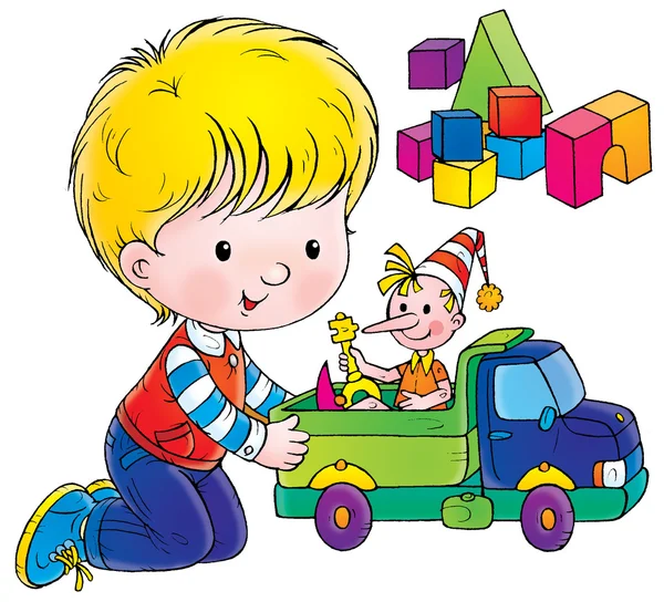 Kleine jongen spelen met een pop in een vrachtwagen speelgoed — Stockfoto