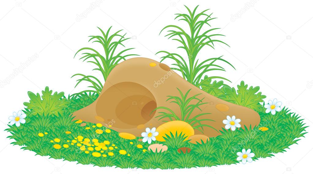 Gopher or mole hill with flowers and grass