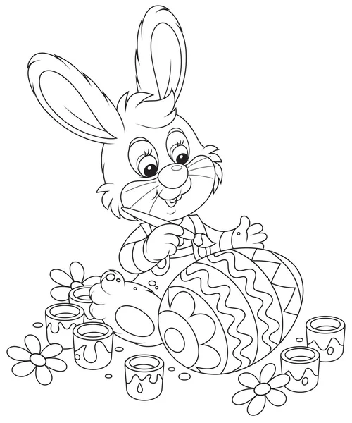 Маленький кролик рисует пасхальное яйцо — стоковый вектор