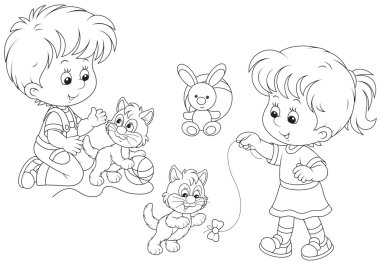 Çocuk yavru kedi ile oyun