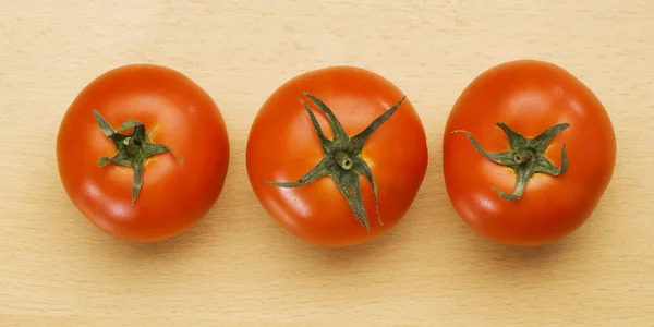 Three tomatoes — Stock Photo, Image