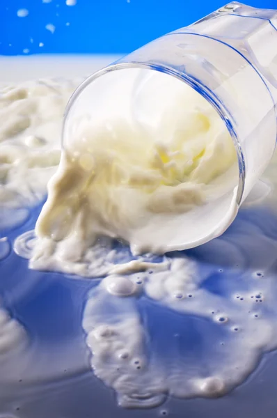 Spilling milk — Stock Photo, Image