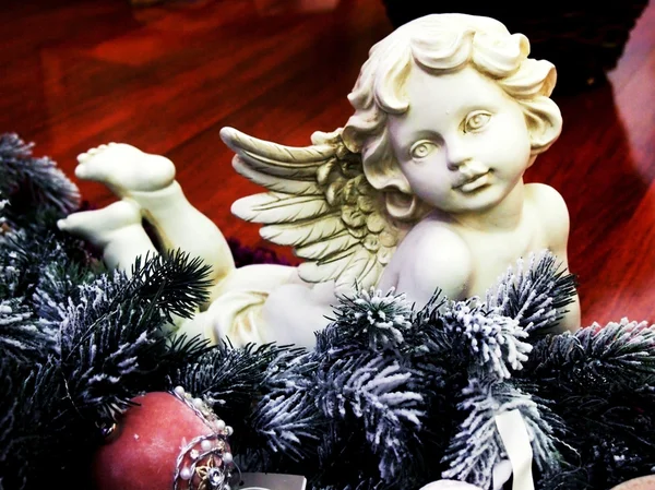 Angel figurine on Christmas tree branch — Stock Photo, Image