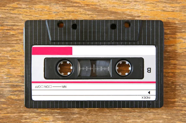Cassette on wooden table — Stock Photo, Image