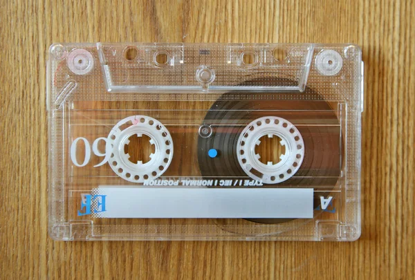 Cassette on wooden table — Stock Photo, Image