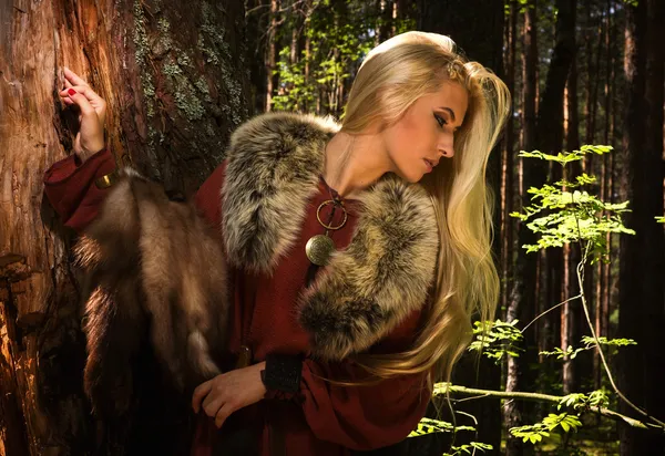 Scandinavian girl with fur skins — Stock Photo, Image