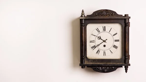 Grandfather clock hanging on a wall — Stock Photo, Image