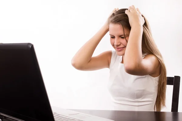 Distraught girl behind a laptop — Stock Photo, Image