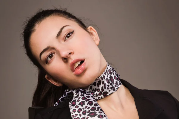 Woman in a black suit sitting — Stockfoto