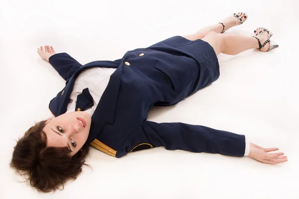 Woman officer lying on a floor — Stock Photo, Image