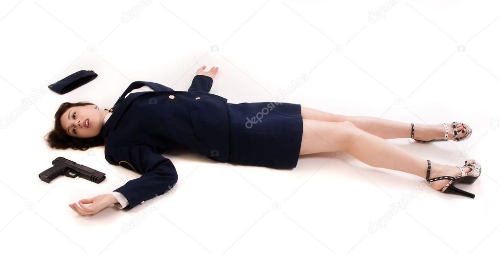 Woman officer lying on a floor