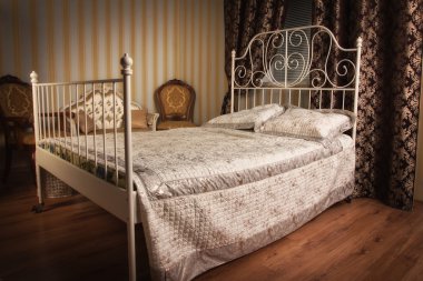 Bed in the elegant bedroom clipart