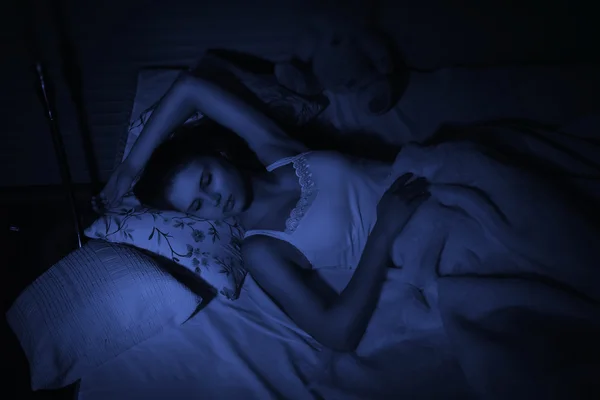 Pretty girl sleeping on the bed — Stock Photo, Image