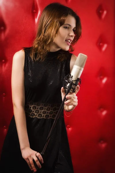 Female singer with microphone — Stock Photo, Image