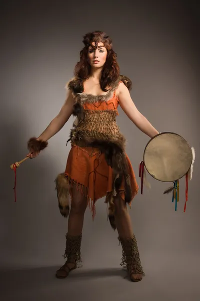 Shaman woman with a tambourine in studio — Stock Photo, Image