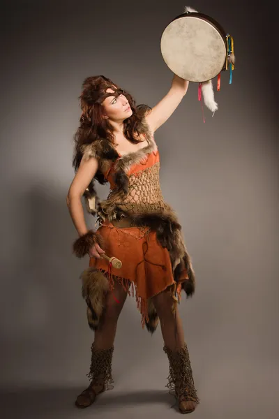 Shaman woman with a tambourine in studio — Stock Photo, Image