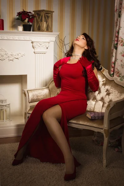 Romantic portrait of a beautiful lady in a red dress — Stock Photo, Image