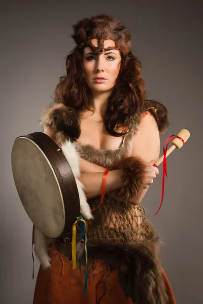 Shaman woman with a tambourine in studio — Stock Photo, Image