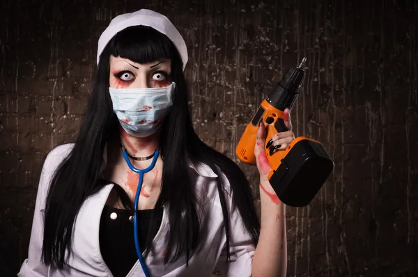 Crazy dead nurse with drill in the hand — Stock Photo, Image