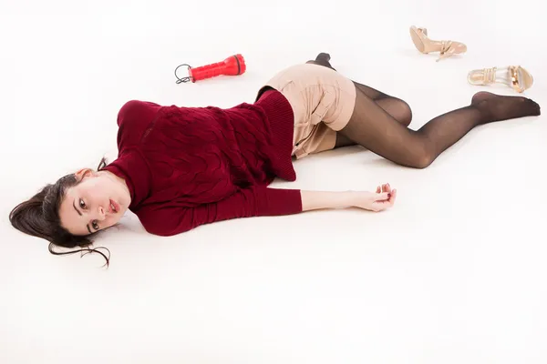 Lifeless brunette lying on the floor — Stock Photo, Image