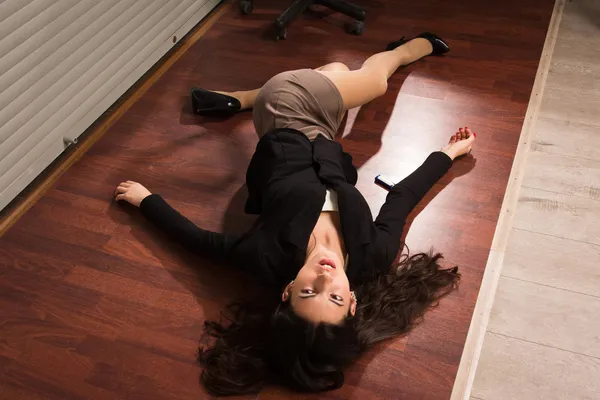 Lifeless businesswoman in a office — Stock Photo, Image