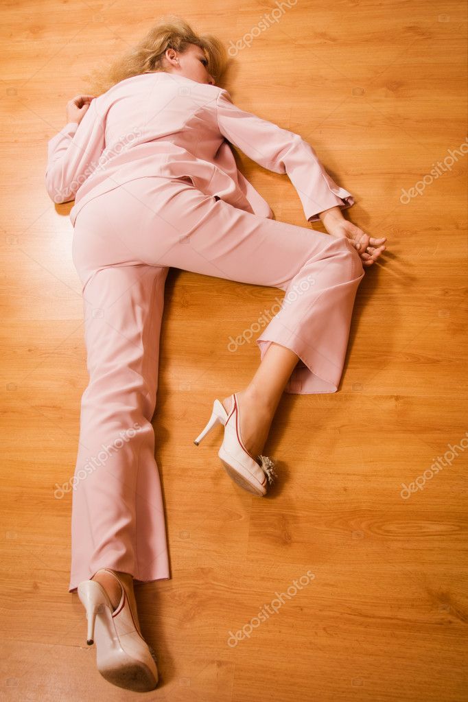 Unconscious Business Woman Lying On The Floor