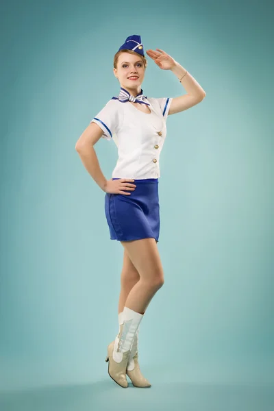 Meisje in stewardess uniform — Stockfoto