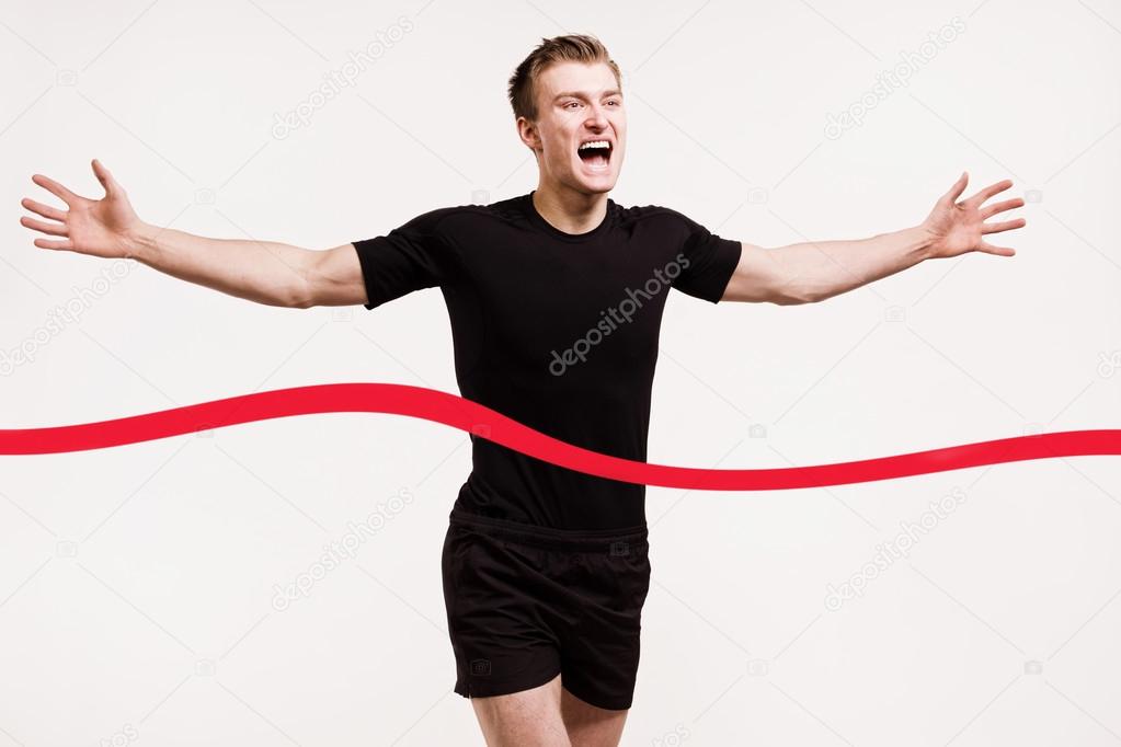 Runner at the finish line isolated on white background