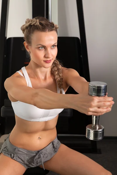 Athletic young woman with dumbbell — Stock Photo, Image